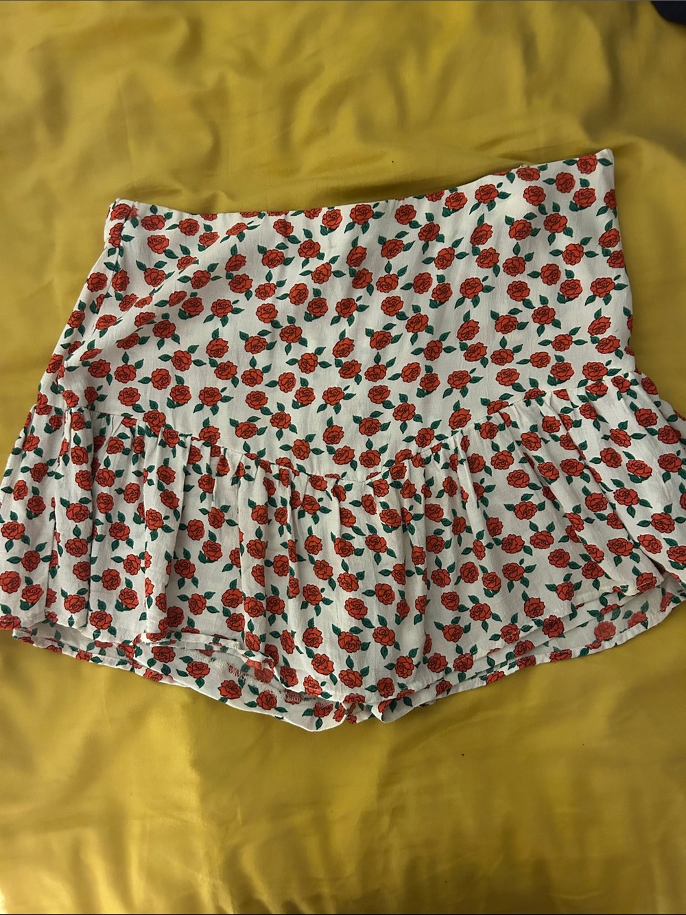 white mini skirt with red flower pattern